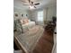 Comfortable bedroom with hardwood floors, a vintage rug, and a full-sized bed at 288 Trickum Creek Rd, Tyrone, GA 30290