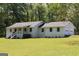 Charming one-story home with a large yard and inviting front porch at 288 Trickum Creek Rd, Tyrone, GA 30290
