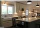 Bright kitchen featuring granite countertops, modern appliances, and stylish fixtures at 288 Trickum Creek Rd, Tyrone, GA 30290