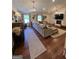 Spacious living room featuring hardwood floors, ample natural light, and a decorative fireplace at 288 Trickum Creek Rd, Tyrone, GA 30290