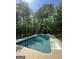 A stunning backyard pool with a spa, perfect for relaxation and entertainment at 288 Trickum Creek Rd, Tyrone, GA 30290