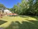 A sprawling, lush green backyard offers plenty of space for activities and relaxation at 96 Daniel Ct, Mcdonough, GA 30253