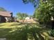 Enjoy a large backyard with mature trees, featuring a sparkling swimming pool and ample green space at 96 Daniel Ct, Mcdonough, GA 30253