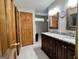 Bathroom featuring a double vanity with granite countertop and wooden cabinets at 96 Daniel Ct, Mcdonough, GA 30253