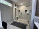 Modern bathroom featuring a glass-enclosed shower, a built-in bench, and elegant tile work at 96 Daniel Ct, Mcdonough, GA 30253