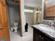 Bright bathroom with a walk-in shower, a marble-topped vanity, and neutral-toned walls for a modern look at 96 Daniel Ct, Mcdonough, GA 30253