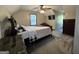 Comfortable bedroom featuring a king-sized bed, soft carpet, and a large window for natural light at 96 Daniel Ct, Mcdonough, GA 30253
