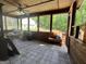 Cozy sunroom featuring wood floors and walls, with plenty of natural light and views of the backyard at 96 Daniel Ct, Mcdonough, GA 30253