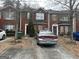 Charming brick townhome featuring a private driveway and cozy curb appeal at 2698 Norfair Loop, Lithonia, GA 30038
