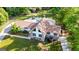 Aerial view showcasing a home with a pool, surrounded by lush greenery and well-maintained landscaping at 3222 Bay View Dr, Jonesboro, GA 30236