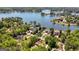 The aerial view of a lakefront community includes luxury homes with lush greenery and waterfront access at 3222 Bay View Dr, Jonesboro, GA 30236