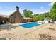Expansive backyard with a pool, patio, and well-maintained landscaping at 3222 Bay View Dr, Jonesboro, GA 30236