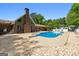 Backyard pool and patio with diving board and lounge chairs perfect for relaxation at 3222 Bay View Dr, Jonesboro, GA 30236