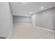 Finished basement with tile flooring and neutral paint at 3222 Bay View Dr, Jonesboro, GA 30236