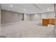 A finished basement with tile flooring and a bar top counter at 3222 Bay View Dr, Jonesboro, GA 30236