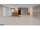 Expansive basement featuring a kitchenette with tile flooring and neutral paint colors at 3222 Bay View Dr, Jonesboro, GA 30236