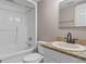 A well-lit bathroom includes a tub, toilet, and vanity with granite countertop at 3222 Bay View Dr, Jonesboro, GA 30236