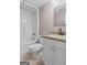 A well-lit bathroom includes a tub, toilet, and vanity with granite countertop at 3222 Bay View Dr, Jonesboro, GA 30236