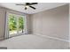 This bedroom features a ceiling fan and a window with natural light at 3222 Bay View Dr, Jonesboro, GA 30236