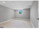 Neutral bedroom with tile floors, base molding, window, and closet at 3222 Bay View Dr, Jonesboro, GA 30236