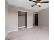 Bedroom with neutral walls, carpeted floors, closet and black door at 3222 Bay View Dr, Jonesboro, GA 30236