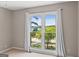 Bedroom showcasing a large window with bright, natural lighting and scenic outdoors at 3222 Bay View Dr, Jonesboro, GA 30236