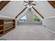 Bonus room with unique roofline, wood beams, carpeted floor and natural light at 3222 Bay View Dr, Jonesboro, GA 30236