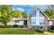 Inviting home exterior with a stone facade, a gable roof, and a lush green lawn at 3222 Bay View Dr, Jonesboro, GA 30236