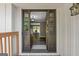Open entryway with decorative glass and dark trim showcases the interior of this beautiful home at 3222 Bay View Dr, Jonesboro, GA 30236