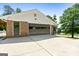 Attached garage with multi-paneled door and extended concrete parking area at 3222 Bay View Dr, Jonesboro, GA 30236