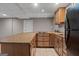 The kitchenette features wood cabinets, granite countertops, and a cooktop at 3222 Bay View Dr, Jonesboro, GA 30236