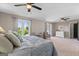 Bright main bedroom featuring neutral walls, plush carpet, sitting area, and picturesque outdoor views at 3222 Bay View Dr, Jonesboro, GA 30236