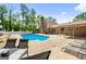Beautiful pool surrounded by lush landscaping, perfect for outdoor relaxation at 3222 Bay View Dr, Jonesboro, GA 30236