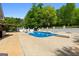 Backyard pool featuring concrete surround, diving board, and several lounge chairs at 3222 Bay View Dr, Jonesboro, GA 30236