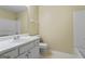 Clean bathroom featuring a modern vanity, toilet, and shower-tub combination at 643 Rangeley Meadows Ct, Hampton, GA 30228