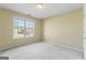 Light-filled bedroom with neutral walls and a large window, offering a calm and inviting atmosphere at 643 Rangeley Meadows Ct, Hampton, GA 30228