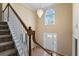 Bright foyer features a chandelier, large window and beautiful staircase at 643 Rangeley Meadows Ct, Hampton, GA 30228