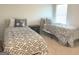 Bedroom featuring two twin beds, and a neutral color palette at 169 Cabin Way, Hampton, GA 30228