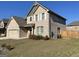 Charming two-story brick home with landscaped yard, two-car garage and a well maintained lawn at 169 Cabin Way, Hampton, GA 30228