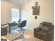 Office with comfortable chair, desk, and recliner provides a dedicated workspace at 169 Cabin Way, Hampton, GA 30228