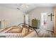 Comfortable bedroom with a vaulted ceiling, green dresser, and adjacent access to the bathroom at 90 Harlin Ct, Covington, GA 30014