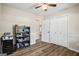 This bedroom features wood floors and a large closet at 90 Harlin Ct, Covington, GA 30014