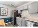 This kitchen showcases gray cabinets and stainless steel appliances at 90 Harlin Ct, Covington, GA 30014