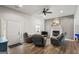 Inviting living room features a fireplace, ceiling fan, and plank flooring at 90 Harlin Ct, Covington, GA 30014