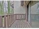 Cozy balcony with wood floors offers a peaceful outdoor space to enjoy the scenic surroundings at 26 Cobblestone Crk, Peachtree City, GA 30269