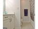 Bright bathroom with a vanity and tub/shower combo at 26 Cobblestone Crk, Peachtree City, GA 30269