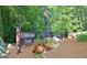 Cobblestone Creek community sign nestled among mature trees and landscaping at 26 Cobblestone Crk, Peachtree City, GA 30269