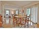 Open dining area with hardwood floors, decorative rug, and a view to living room at 26 Cobblestone Crk, Peachtree City, GA 30269