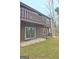 Rear exterior view of the home with a covered patio, overlooking the backyard at 26 Cobblestone Crk, Peachtree City, GA 30269