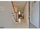 Entrance foyer with tile flooring, stairs, and a view to the living room at 26 Cobblestone Crk, Peachtree City, GA 30269